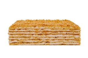Delicious multi layered napoleon cake with crumb topping isolated on white background photo