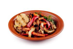Grilled vegetables on plate with lemon, healthy vegan lunch photo