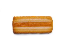 Rectangular cookie with apricot filling on white background photo