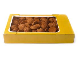 Cardboard box full of chocolate chip cookies isolated on white background photo