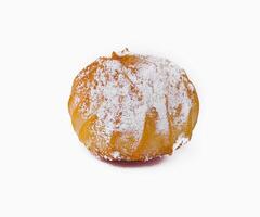 Delicious round donut covered with powdered sugar on white background photo