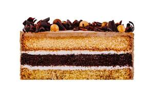 Delicious layered cake with chocolate curls and icing on white background photo