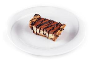 Chocolate cake being placed on white plate photo