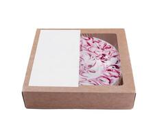 Delicious swirl cheesecake in cardboard box with blank label for mock up photo