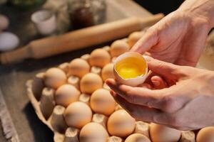 Cracked Egg with Yolk in Rustic Kitchen photo