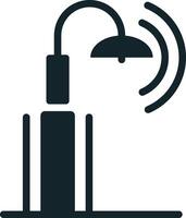 Simple icon of a smart streetlight sending data wirelessly vector