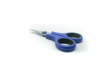 Blue scissors isolated on a white background photo