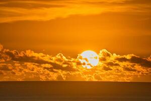 Beautiful golden sunset over the ocean, Mahe Seychelles photo