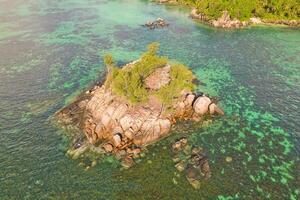 Drone arial shot of Anse royale, fairy land small island, mice island, with granite stones and turquoise water, Mahe Seychelles photo