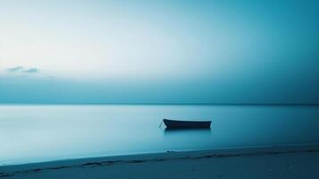 A photo of a beach at dawn, where the entire scene is tinted in shades of blue. The only element in the photo is a small boat anchored in the distance