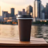 cardboard dark brown coffee cup without labels with a plastic black lid on a blurred urban background with skyscrapers in the distance photo