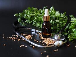 Cold-pressed coriander oil has properties in helping the digestive system, as a facial lotion, as a massage for relaxing muscles after exercise. Healthy concept. photo