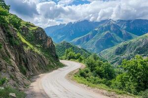 Twisting Mountain Road with Sharp Hairpin Curves and Breathtaking Valley Views, Framed by a Clean White Background photo