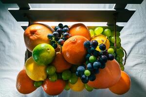 Fresh Citrus and Grapes in Crate photo
