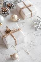 Vertical New Year Christmas background with copy space. Christmas tree branches, balls, pine cones and gifts. Template for card, invitation, banner. photo