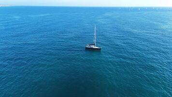 A serene sailing adventure on calm waters under a clear blue sky during a peaceful afternoon photo