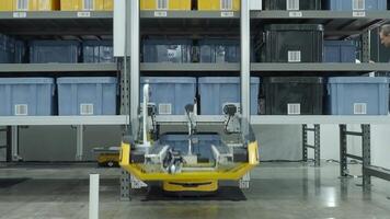 Demonstration of Automated Retail Warehouse AGV Robots Delivering distribution product stock on shelf in modern factory. Smart warehouse Logistics management system with warehouse robot. AI Technology video
