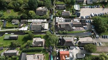 Boats saling through small canals in Giethoorn video