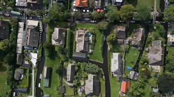 Aerial view of boats sailing between houses video