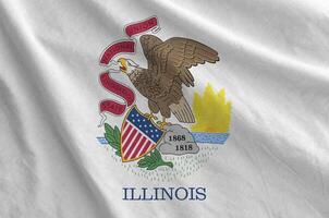 Illinois US state flag depicted on folded wavy fabric of old cloth photo