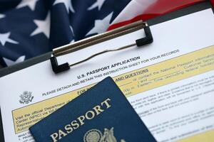 Department of State form DS11 Application for a U.S. Passport lies on table and ready to fill photo