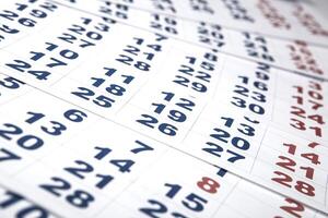 sheets of wall calendar with the number of days photo