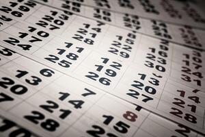 sheets of wall calendar with the number of days photo