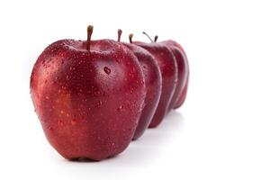 maroon apples lined up in a row closeup photo