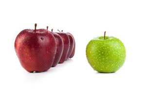 maroon apples lined up in a row and green apple closeup photo