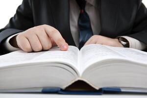 man is looking for information in the dictionary photo