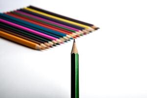 row of colored pencils and simple pencil photo