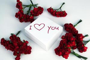notebook with marker inscription I love you and roses photo