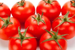 some red tomatoes close-up on a white background photo