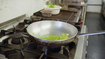 Cooking Onion And Courgettes In A Pan At A Restaurant video
