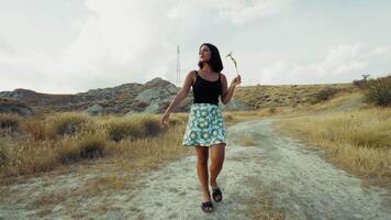 Woman Smelling Flower While Walking In The Nature video