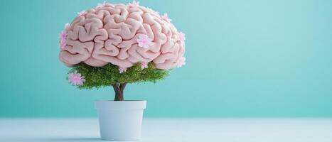 A unique artistic representation of a brain growing on a tree with pink flowers, set against a light turquoise backdrop photo
