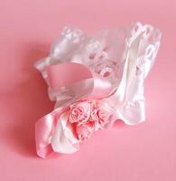 The bride's garter on a pink background. photo