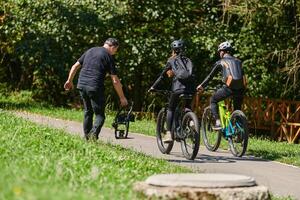 A professional videographer skillfully captures the joyous journey of a couple on bicycles through the park, blending cinematic expertise with the natural allure of outdoor adventure photo