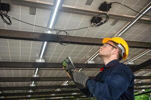 Engineer technical service checking installation solar cell panel and check all the lists on clipboard photo
