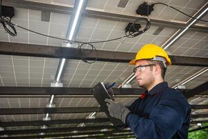 Engineer technical service checking installation solar cell panel and check all the lists on clipboard photo