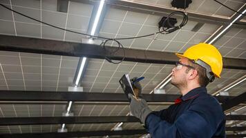 Engineer technical service checking installation solar cell panel and check all the lists on clipboard photo