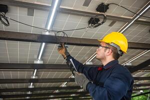 Engineer technical service checking installation solar cell panel and check all the lists on clipboard photo