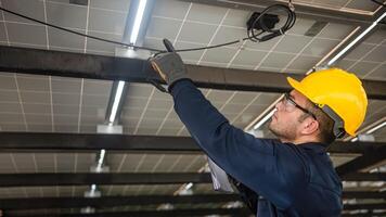 Engineer technical service checking installation solar cell panel and check all the lists on clipboard photo