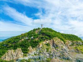 Top view of Vung Tau with statue of Jesus Christ on Mountain . the most popular local place. Christ the King, a statue of Jesus. Travel concept. photo