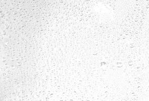 Close-Up of Water Drops on Glass Surface photo