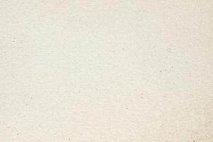 Textured Beige Paper with Grainy Surface photo