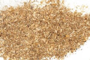 Close-Up of Wood Shavings and Sawdust on White Background photo