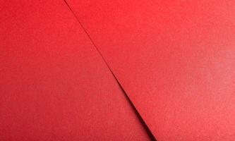 Red scarlet color paper background, smooth glowing shining texture, backdrop photo