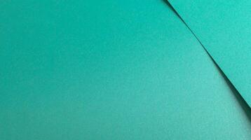 Turquoise color paper background, smooth glowing shining texture, banner photo