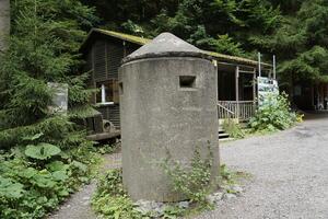 Osowka, Gluszyca, Poland - August 06th, 2024 - Concrete guard booth at entrance to underground tunnels photo